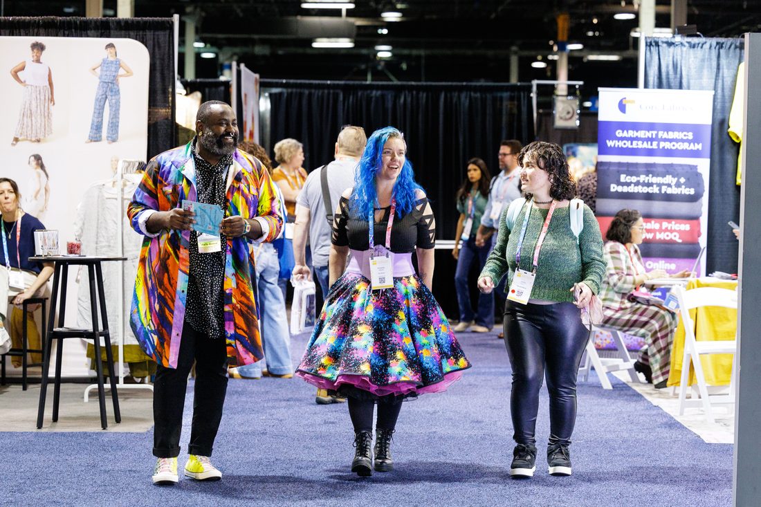 A maker in a handmade outfit at h+h americas