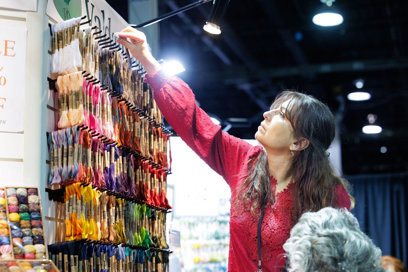 A wall of embroidery threads and floss